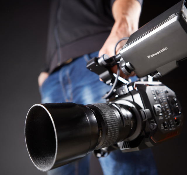 Holding a video camera on a local shoot for video production in Tokyo